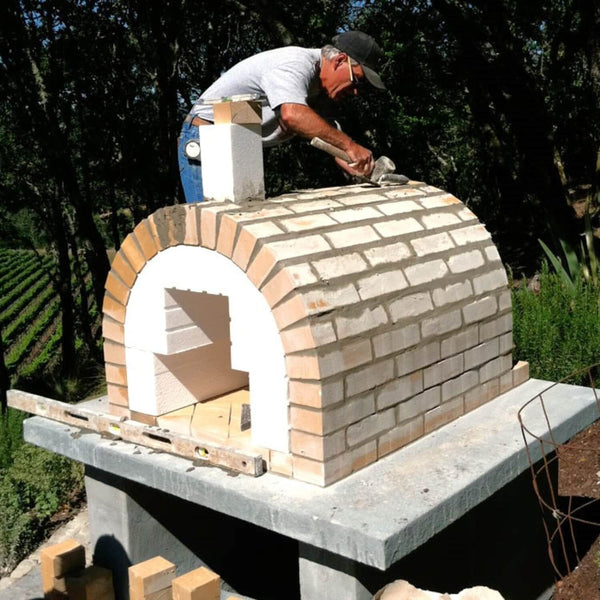 Firebrick being used to build a firebrick pizza oven