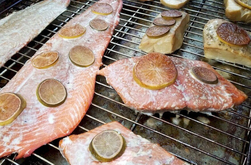 Smoking Salmon and Black Bass in a BrickWood Box using flavorful Alder cooking wood.